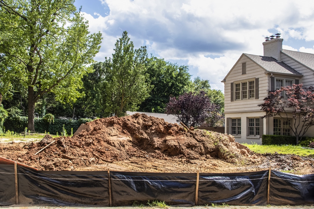 pile of dirt in front of house