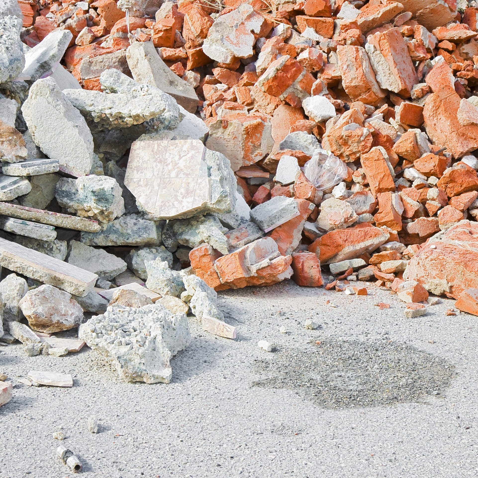 Concrete and brick rubble debris on construction site after a demolition