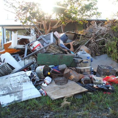 Back yard covered in debris and garbage after storm