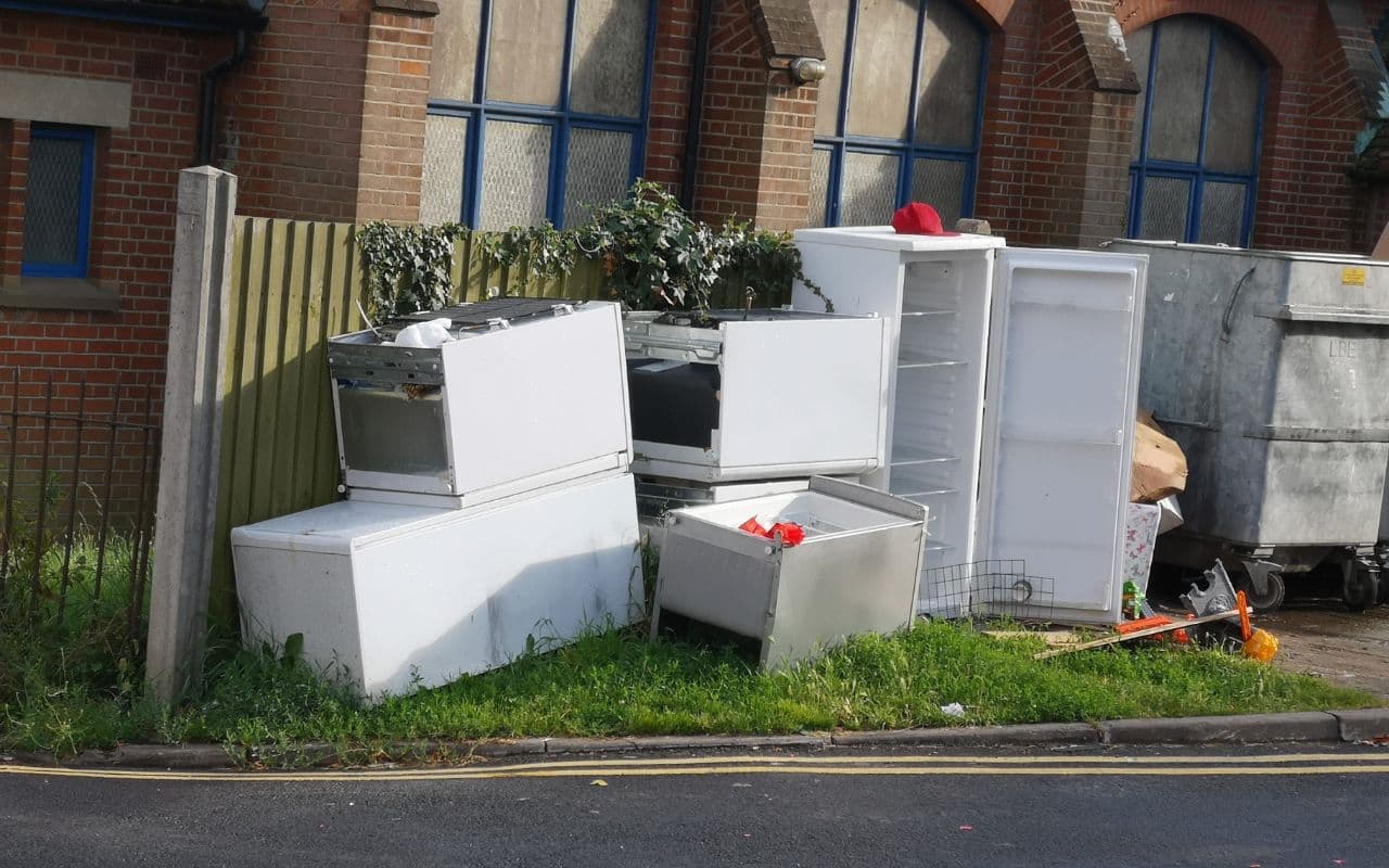 child-standing-near-garbage